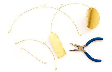 attach the brass shapes to the wire pieces