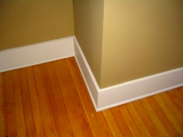 4-inch white baseboards on beige wall.