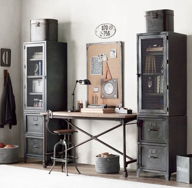industrial office idea with metal cabinets and cork board on wall