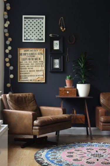 Black walls and leather furniture