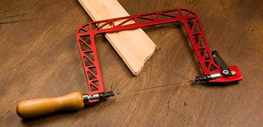 Coping saw and baseboard.