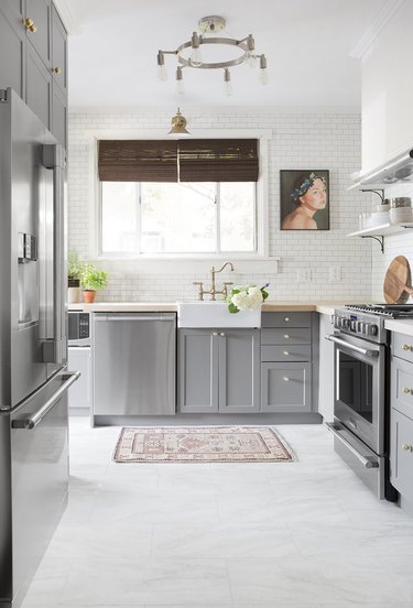 marble kitchen vinyl flooring with gray cabinets and farmhouse sink