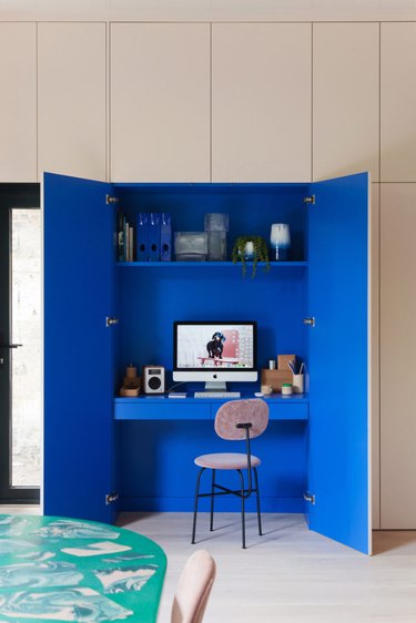 hidden office kitchen storage idea with shelving and desk