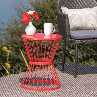 Red wire outdoor side table in outdoor setting