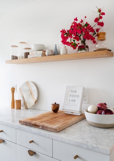 Designlovefest kitchen with white cabinets and open shelving and marble countertops