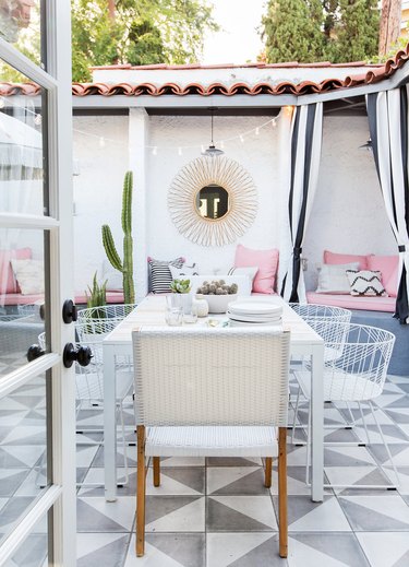 Designlovefest backyard with patterned tile and cozy seating