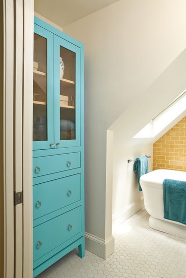 attic bathroom ideas with yellow tile walla and aqua cabinet