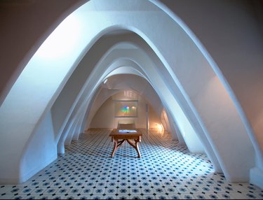 room with arched ceiling and patterned floor