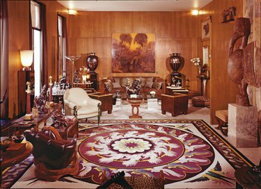 apartment with large patterned rug and wood walls