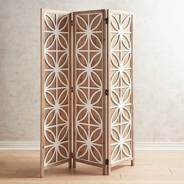 room divider idea for the living room with patterned screen