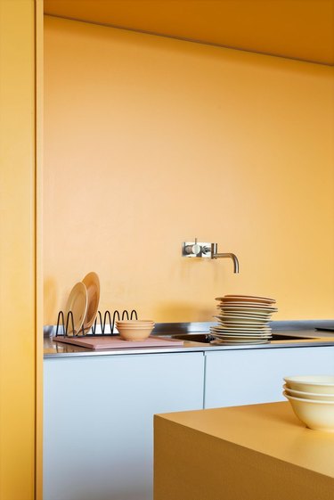 kitchen space with yellow wall