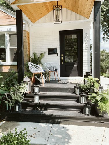 black exterior door idea for white house with wood accents