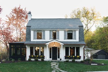 Gray exterior house shutters with white exterior in classic colonial style