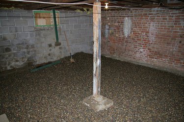 Unfinished basement with brick walls.