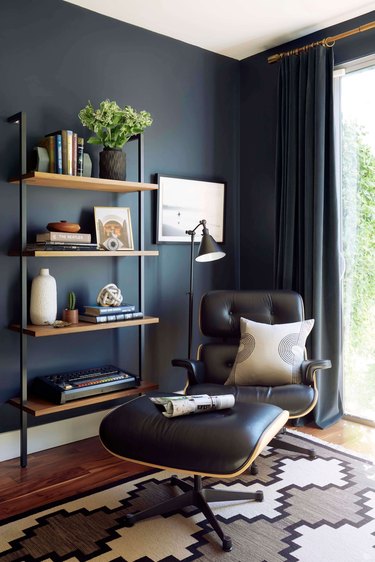industrial office idea with reading nook and steel-framed shelving