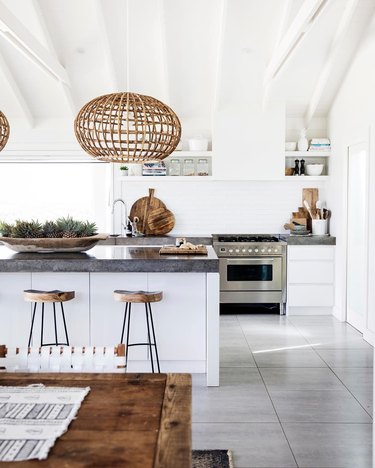 Large-scale bohemian kitchen lighting with woven pendant lights hanging above island