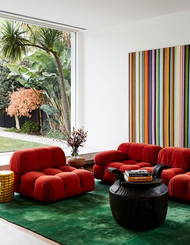 Red and green complementary colors in vintage-inspired living room