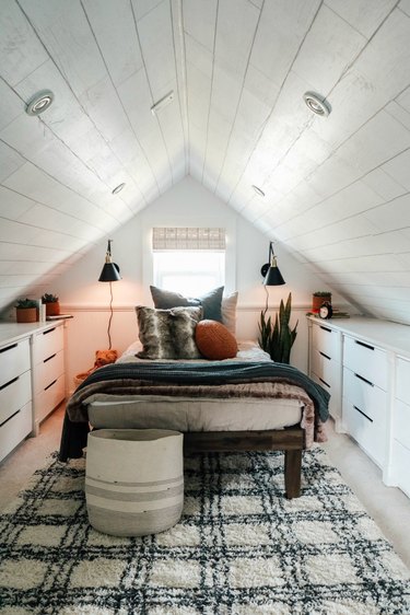 painted ceiling in bedroom with slanted walls