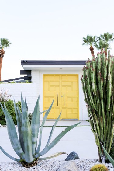 Midcentury modern exteriors with bright yellow doors