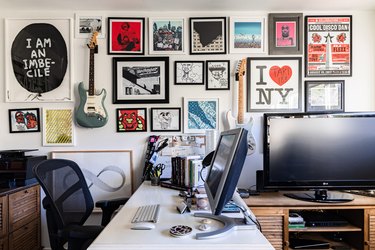Gallery wall of art in home office