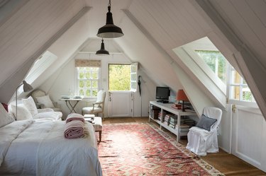 small attic library in bedroom with rug