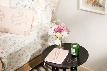 Floral bedding and night table