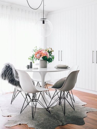 white modern glam dining room cowhide rug