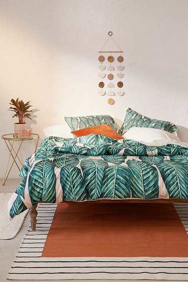 tropical bedroom with palm print duvet and pillowcases