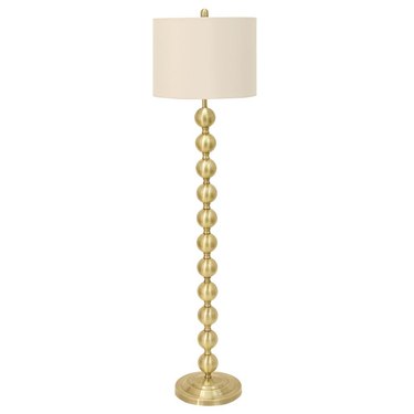 Floor lamp with white shade and brass, stacked-ball base