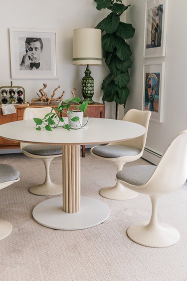 The custom wood dowel detail on this otherwise plain IKEA table gives it character and dimension.