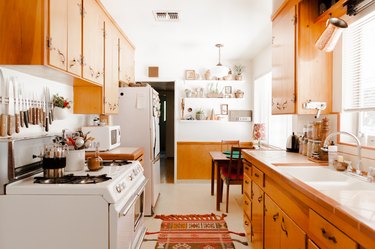 kitchen with wood cabinets and a rug