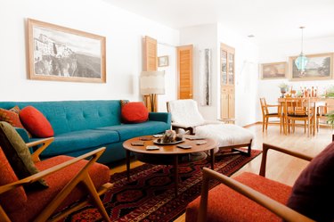 living room with a turquoise couch