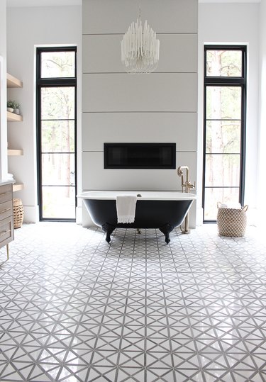 Modern bathroom with clawfoot bathtubs and patterned floor tile