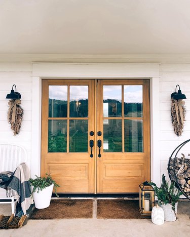 farmhouse fall decor on porch in natural hues