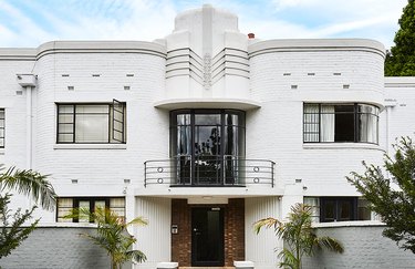 white Art Deco exterior home styles with curved balcony