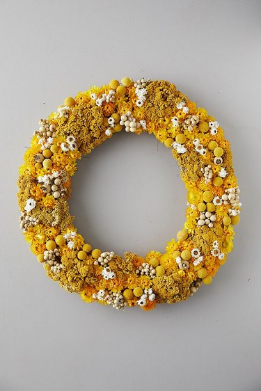yellow fall wreath made with yellow flowers