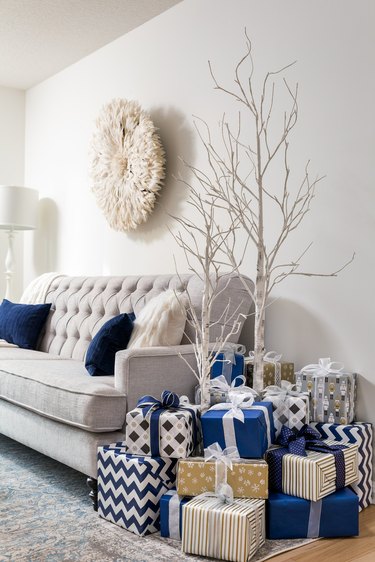 coastal living room at Christmas with white birch coastal Christmas tree