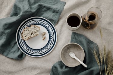 dining table with Cultiver linens and ceramic dishware