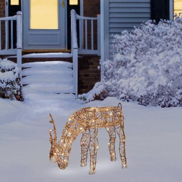 exterior Christmas decorations with Light up reindeer on snowy front yard