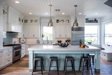 Coastal kitchen ideas with blue island and white cabinets