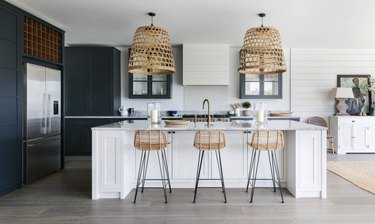 Modern coastal kitchen ideas with basket lights over island