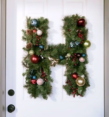 Christmas Door Decorations with H-shaped door wreath with Christmas ornaments.