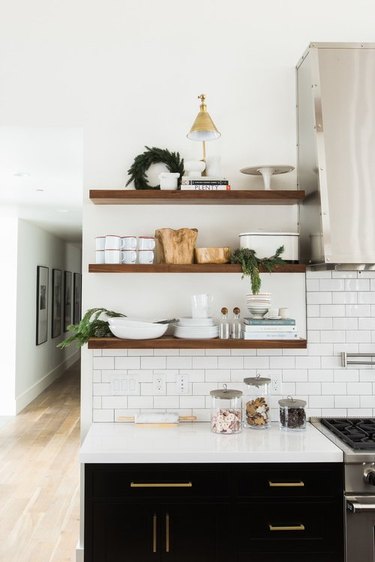 Christmas wreath and decor on open kitchen shelving by Studio McGee