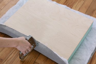 Stapling fabric and batting onto plywood