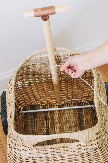 Securing handle to basket with zip ties