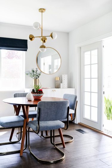 white dining room with midcentury decor