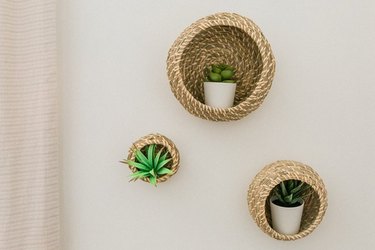 Basket wall planters with succulents.