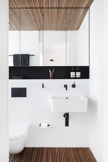 monochrome color palette with wall-mounted bathroom sink