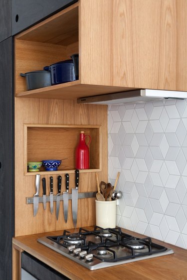 modern kitchen storage idea with clever storage above and to the side of the stove