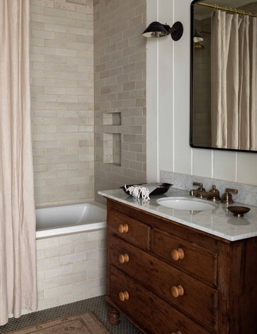 cream color shower tile in bathroom